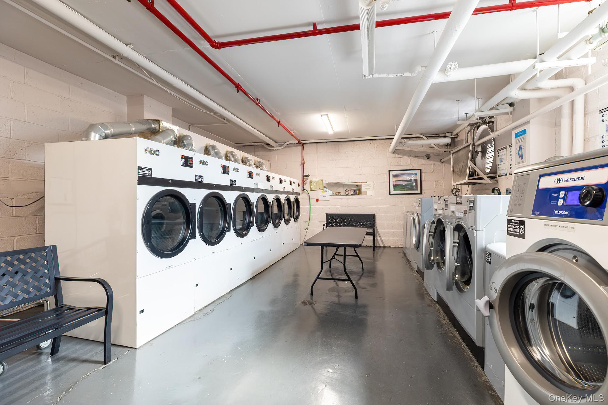 25 Knolls Crescent, Unit 9E Bronx, NY 10463 - Photo 18 of 23 Shared laundry room featuring washing machine and dryer