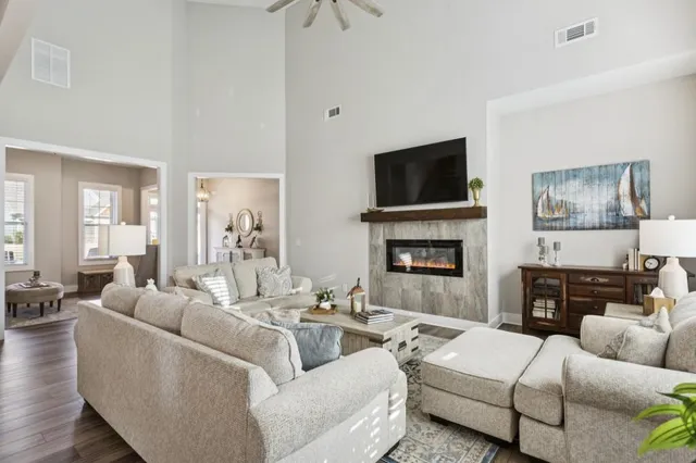 a living room with furniture and a flat screen tv
