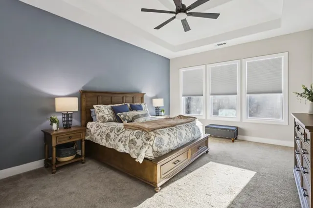 a spacious bathroom with a double vanity sink mirror and shower