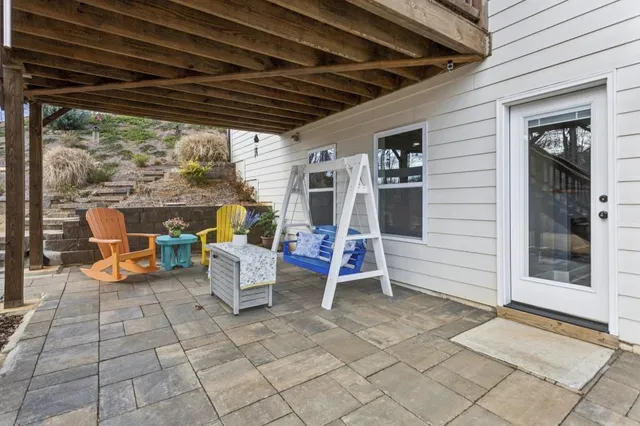 a view of a house with snow in front of house