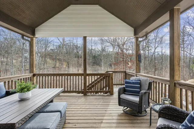a front view of a house with garden and sitting area