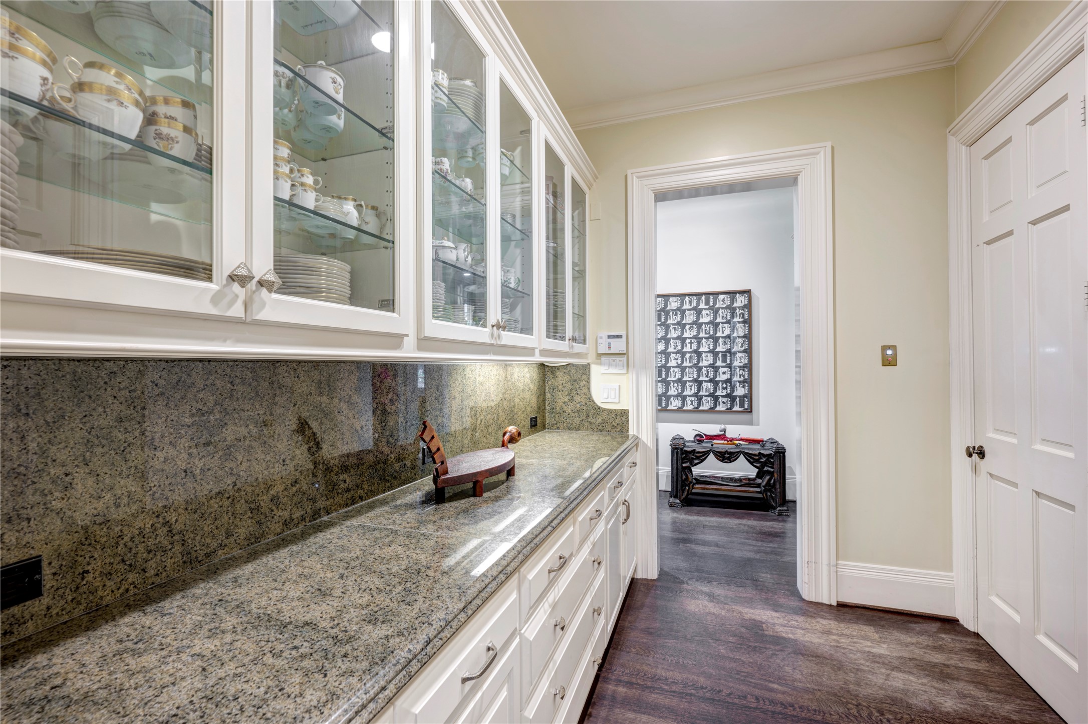 3653 Inverness Drive Houston, TX 77019 - Photo 13 of 39 The Butler’s Pantry is situated between the Dining Room and the Grand Hall, and it offers an abundance of glass-front cabinets and ample drawers. The Butler’s Pantry includes an elevator to all three floors and a silver closet.