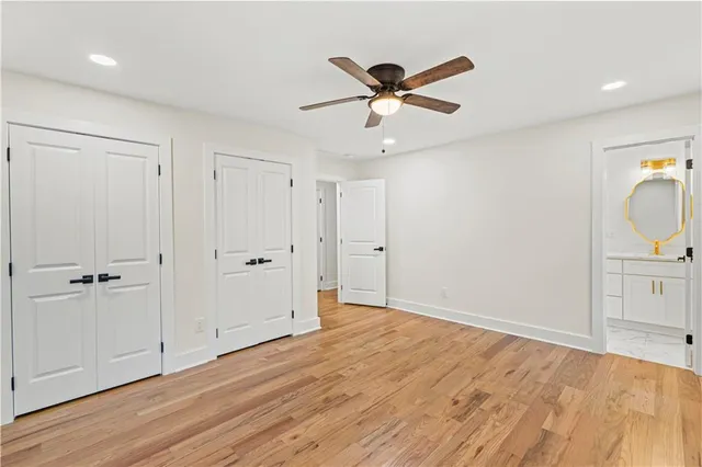 a bathroom with a toilet a sink and a mirror