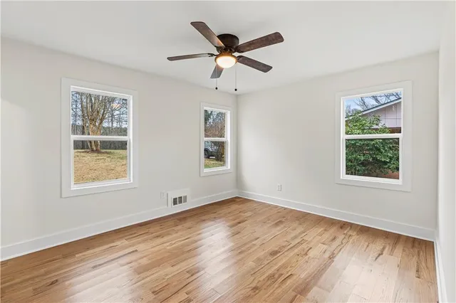 a backyard of a house with wooden floor