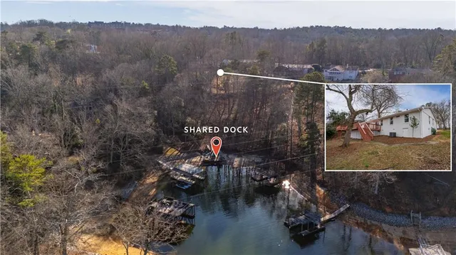 a view of a kitchen with wooden floor and a sink