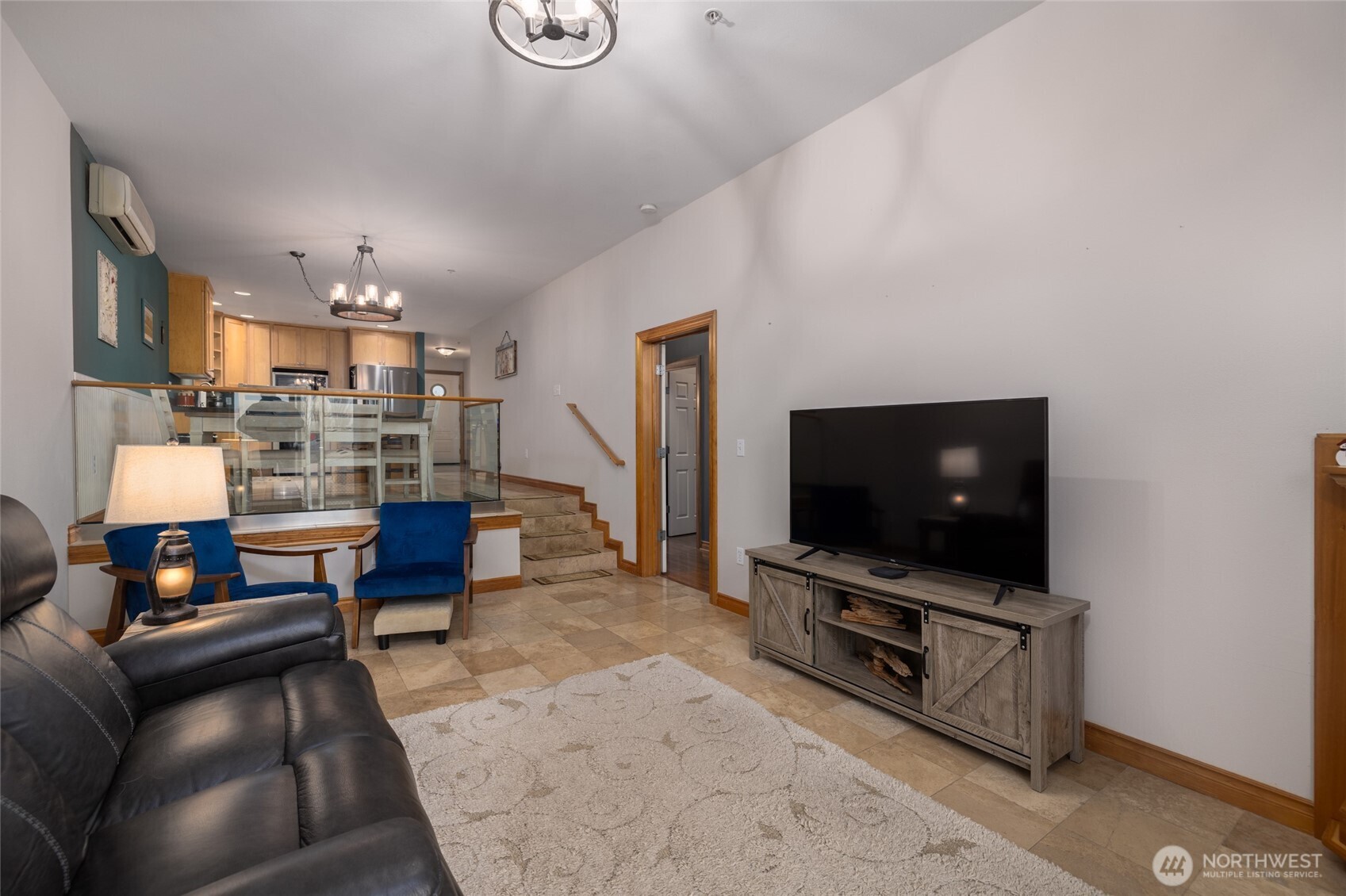 3706 Portage Lane, Unit 102 Anacortes, WA 98221 - Photo 14 of 23 a living room with furniture and a flat screen tv