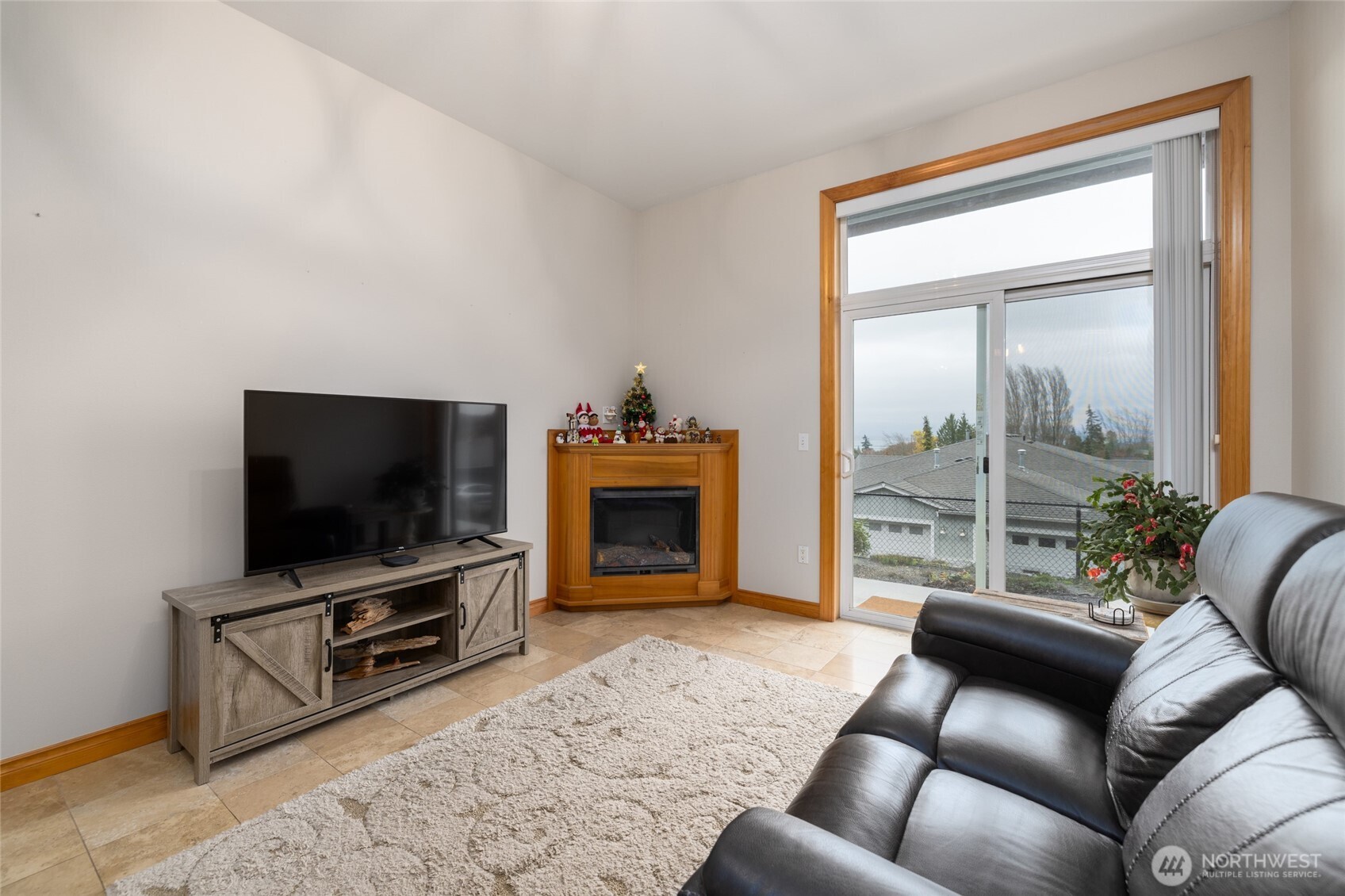 3706 Portage Lane, Unit 102 Anacortes, WA 98221 - Photo 15 of 23 a living room with furniture and a flat screen tv