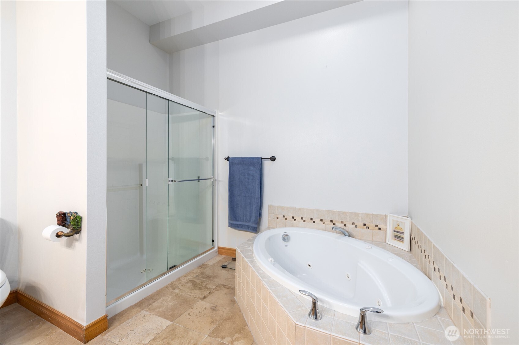 3706 Portage Lane, Unit 102 Anacortes, WA 98221 - Photo 20 of 23 a bathroom with a tub and shower