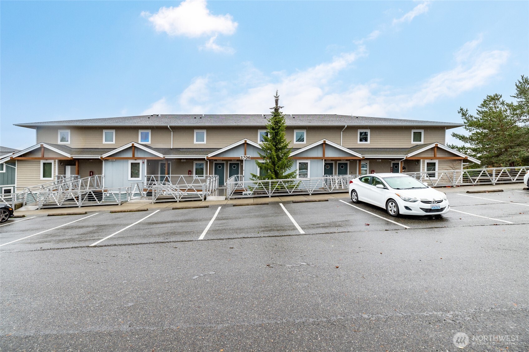 3706 Portage Lane, Unit 102 Anacortes, WA 98221 - Photo 22 of 23 a view of multiple houses with a street