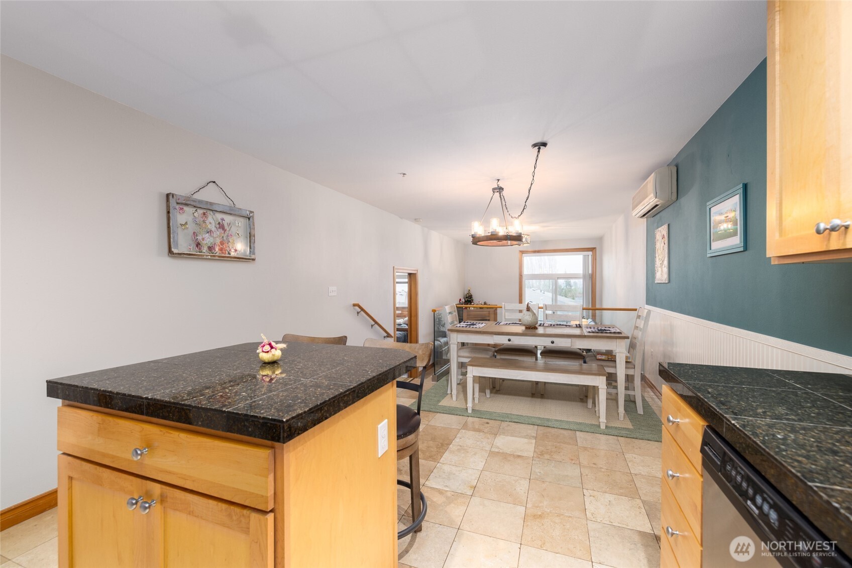 3706 Portage Lane, Unit 102 Anacortes, WA 98221 - Photo 10 of 23 a living room with stainless steel appliances granite countertop furniture and a chandelier