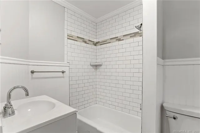 a bathroom with a sink and shower