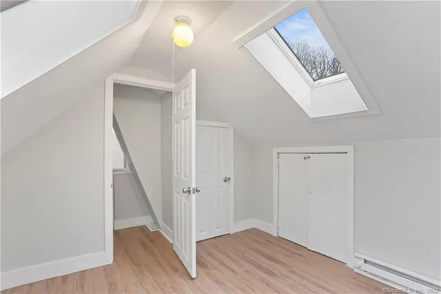 a view of an entryway with wooden floor