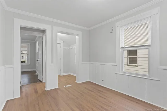 a view of wooden floor and windows in a room