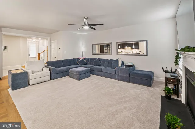 a kitchen with stainless steel appliances a refrigerator a sink a stove and cabinets