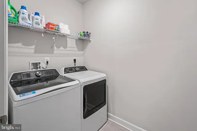 a bedroom with bed and flat tv screen on dresser