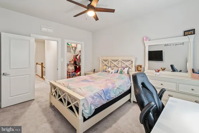 a bathroom with double sink and two mirror