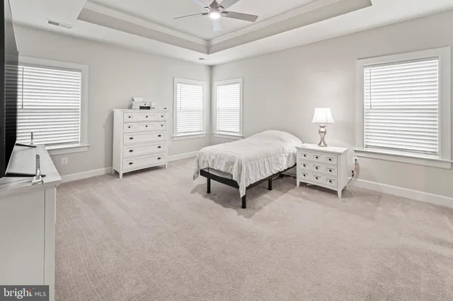 a view of walk in closet with clothes
