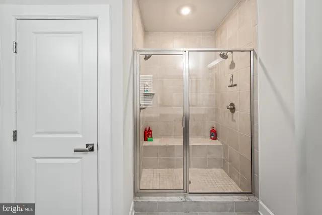 a bedroom with a bed and flat screen tv