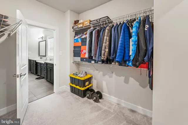 a bedroom with furniture and a flat screen tv