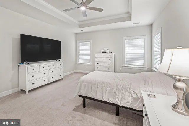 a bathroom with a sink a toilet a mirror and vanity