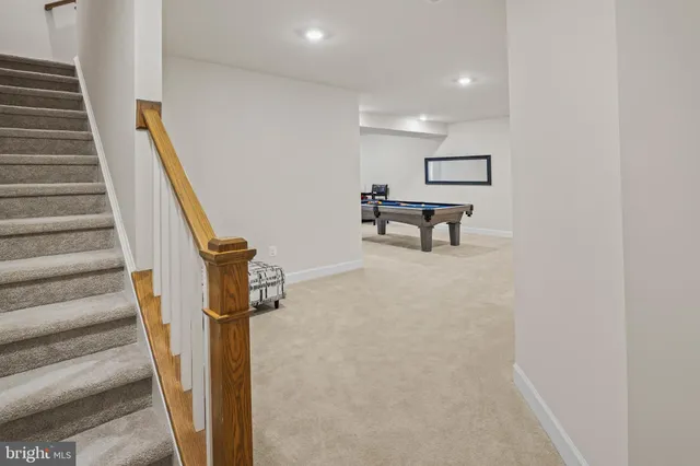 a bathroom with a shower and a glass door
