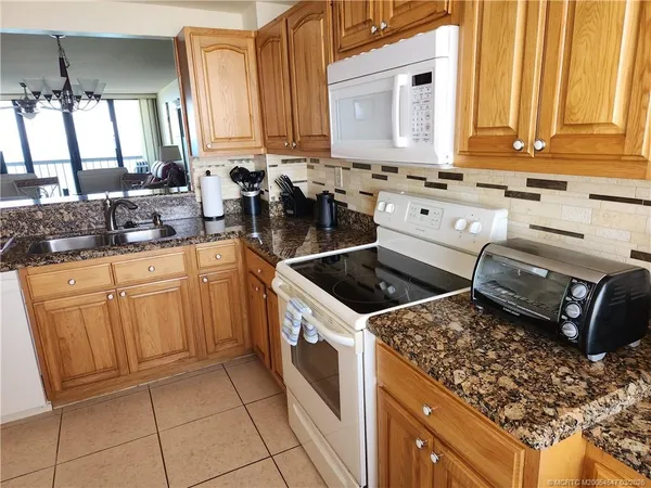 a kitchen with a stove and a sink