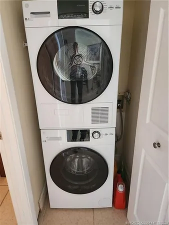 a bedroom with two beds and a window
