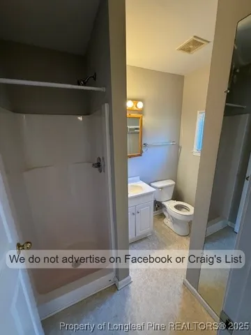 a bathroom with a toilet and a sink