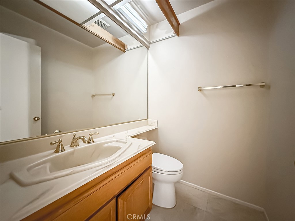 5542 Las Virgenes Road, Unit 97 Calabasas, CA 91302 - Photo 20 of 50 a bathroom with a sink a toilet and a mirror
