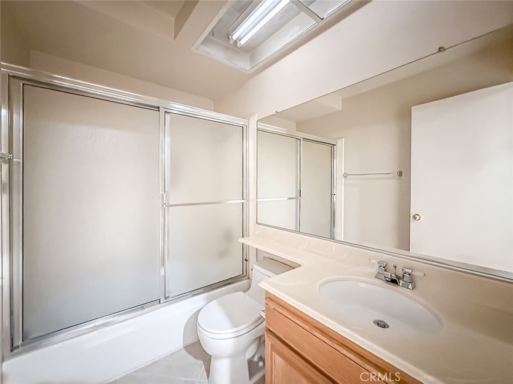 5542 Las Virgenes Road, Unit 97 Calabasas, CA 91302 - Photo 28 of 50 a bathroom with a sink and a large mirror