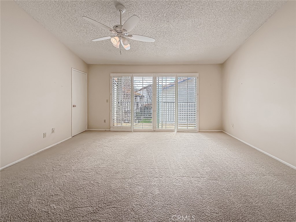 5542 Las Virgenes Road, Unit 97 Calabasas, CA 91302 - Photo 29 of 50 an empty room with windows and ceiling fan