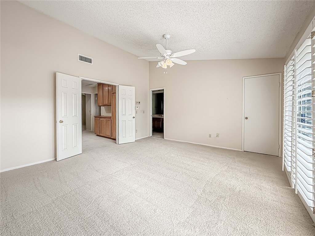5542 Las Virgenes Road, Unit 97 Calabasas, CA 91302 - Photo 31 of 50 an empty room with closet and windows
