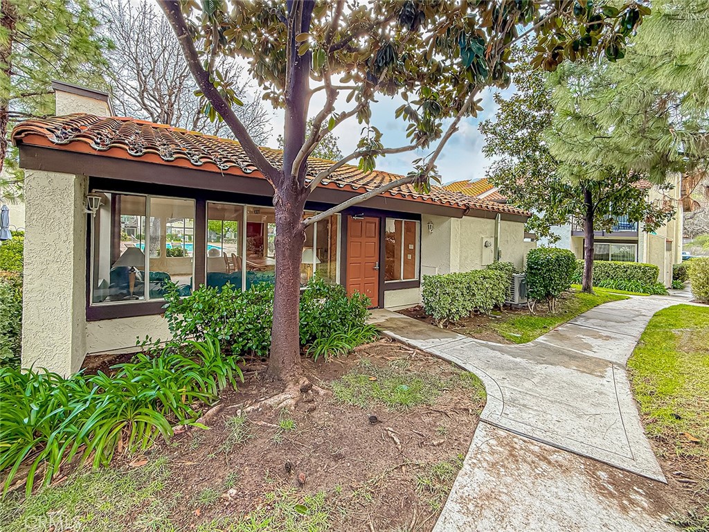 5542 Las Virgenes Road, Unit 97 Calabasas, CA 91302 - Photo 47 of 50 a front view of a house with garden