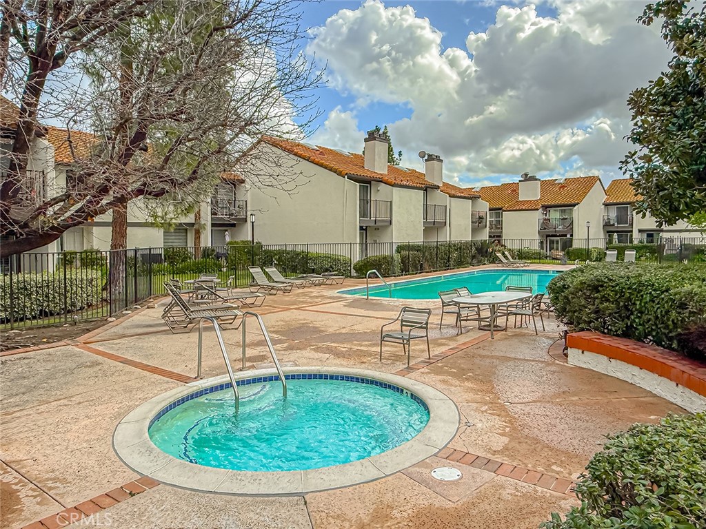 5542 Las Virgenes Road, Unit 97 Calabasas, CA 91302 - Photo 48 of 50 a view of a house with a swimming pool