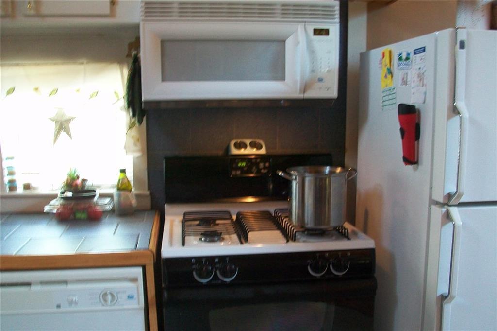 240 Stratton Road Dallas Plt, ME 04970 - Photo 9 of 23 Kitchen with gas range and dishwasher