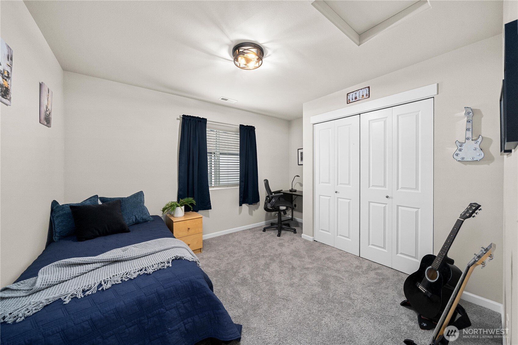 26239 227th Terrace Southeast Maple Valley, WA 98038 - Photo 26 of 37 a bedroom with furniture and a closet
