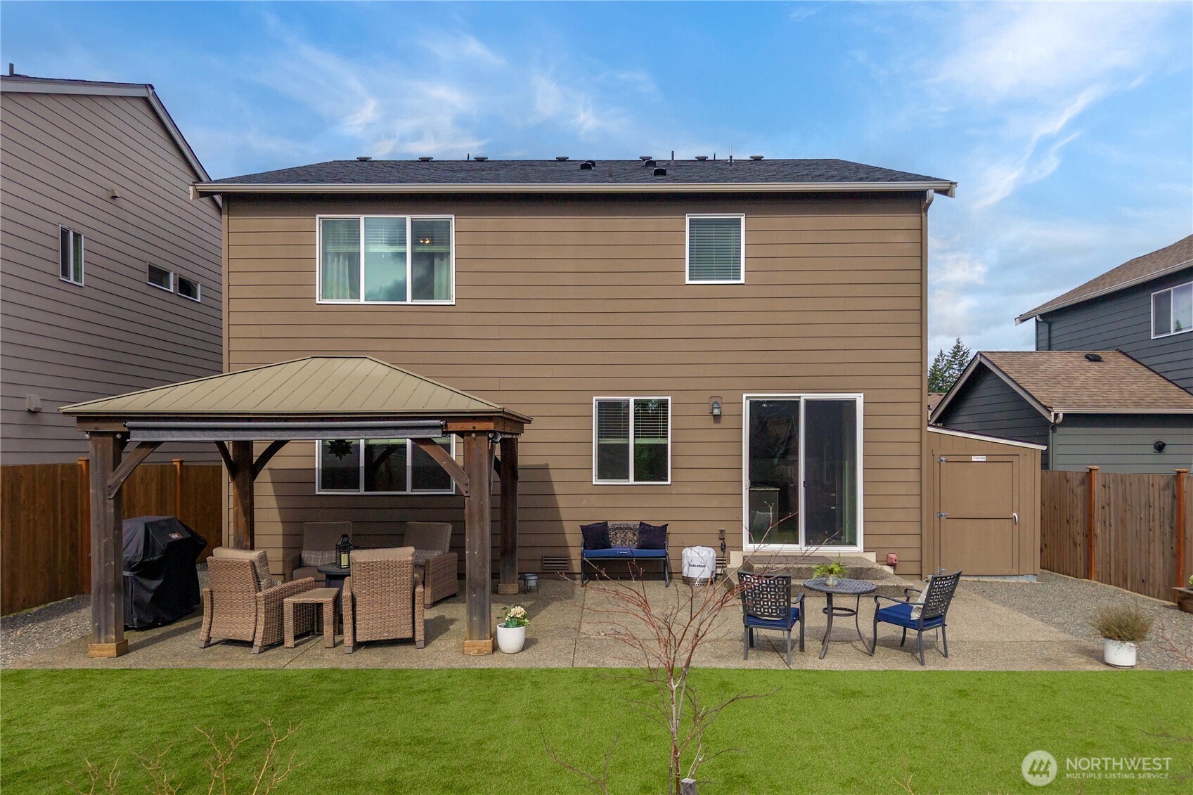 26239 227th Terrace Southeast Maple Valley, WA 98038 - Photo 35 of 37 a view of a house with a yard and sitting area