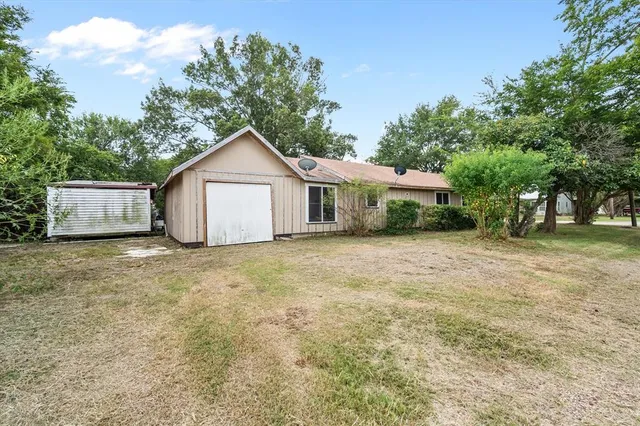 a house with trees in the background