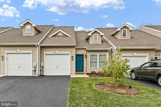 front view of a house with a garden