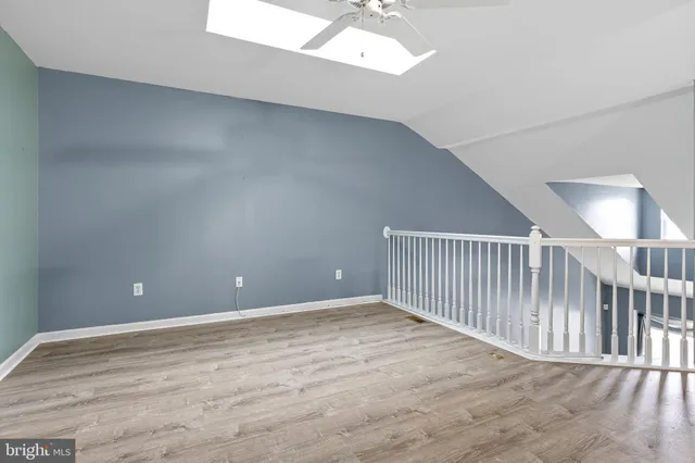 a view of an empty room with stairs