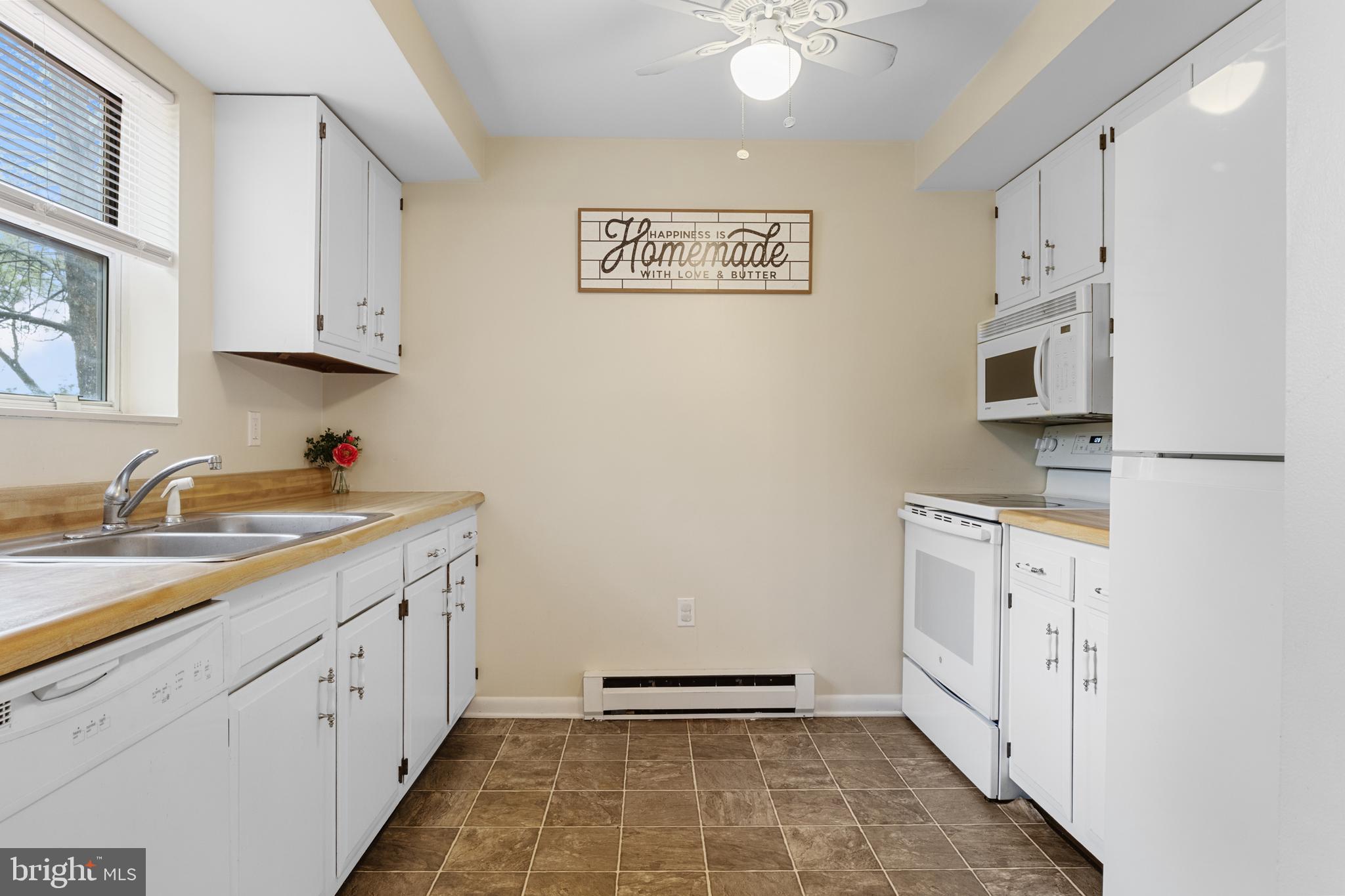 3530 Middleboro Road Dover, PA 17315 - Photo 16 of 57 a kitchen with granite countertop white cabinets and white appliances