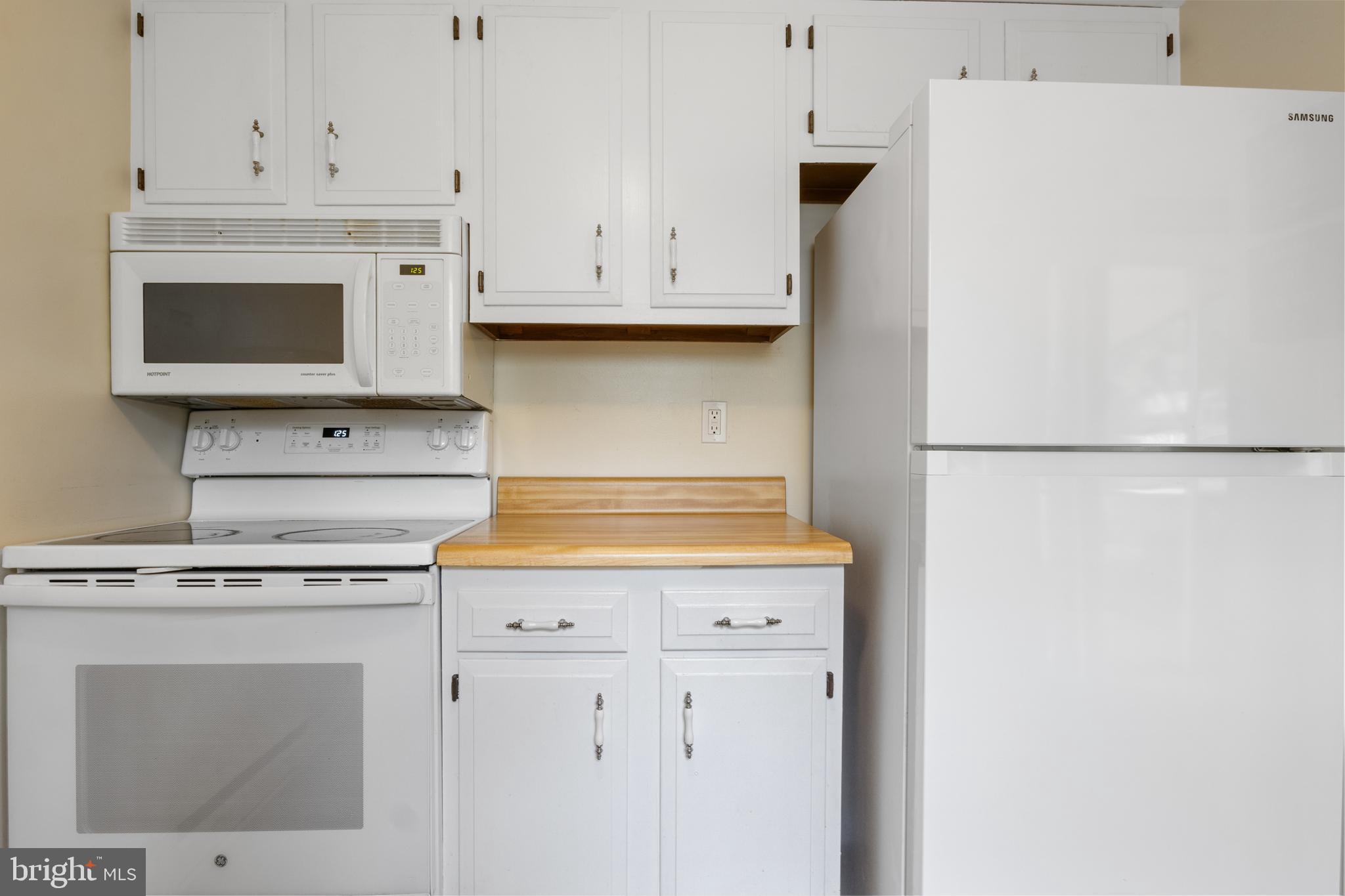 3530 Middleboro Road Dover, PA 17315 - Photo 19 of 57 a kitchen with granite countertop white cabinets and stainless steel appliances