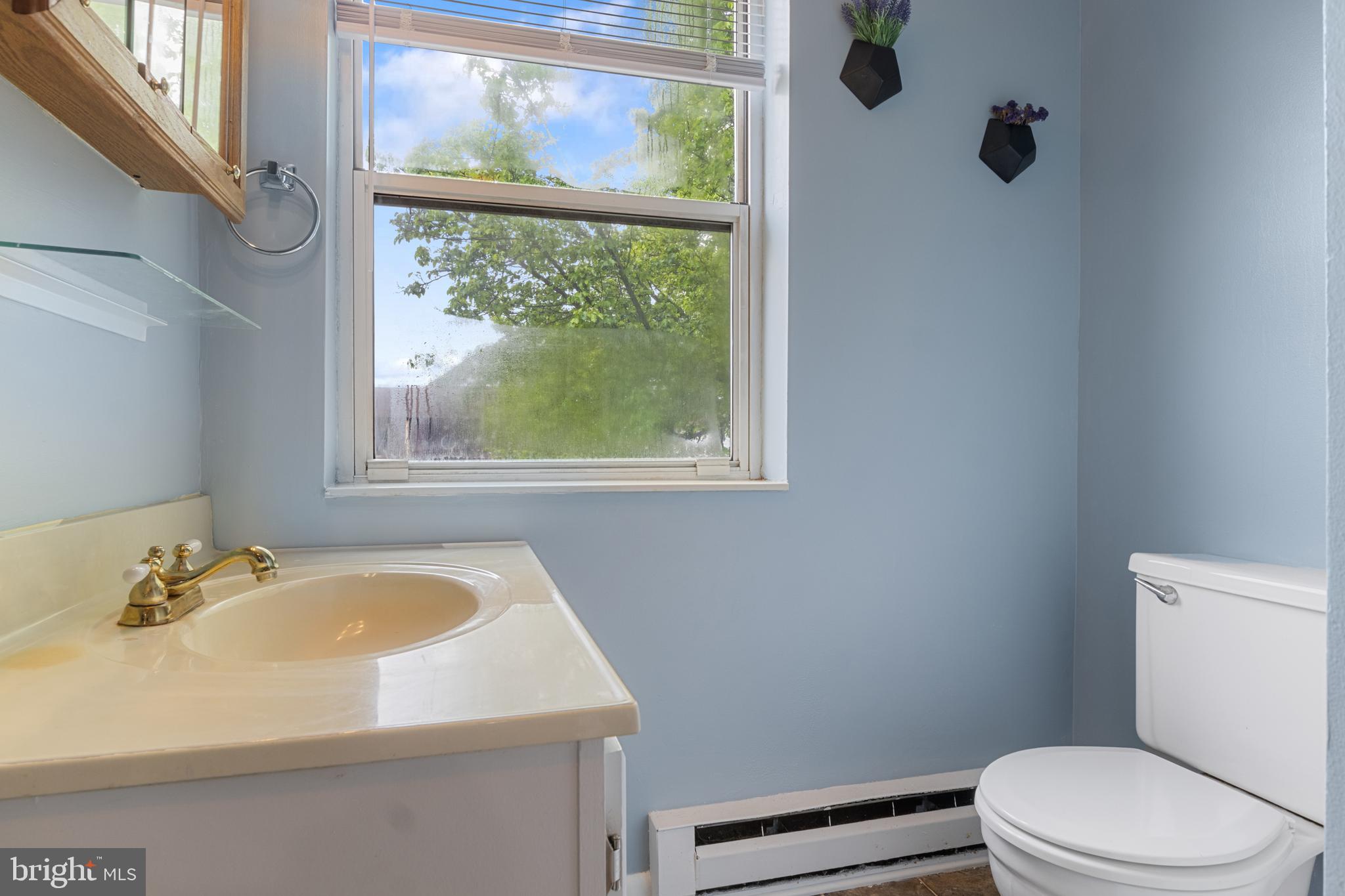 3530 Middleboro Road Dover, PA 17315 - Photo 29 of 57 a bathroom with a sink a toilet and a window