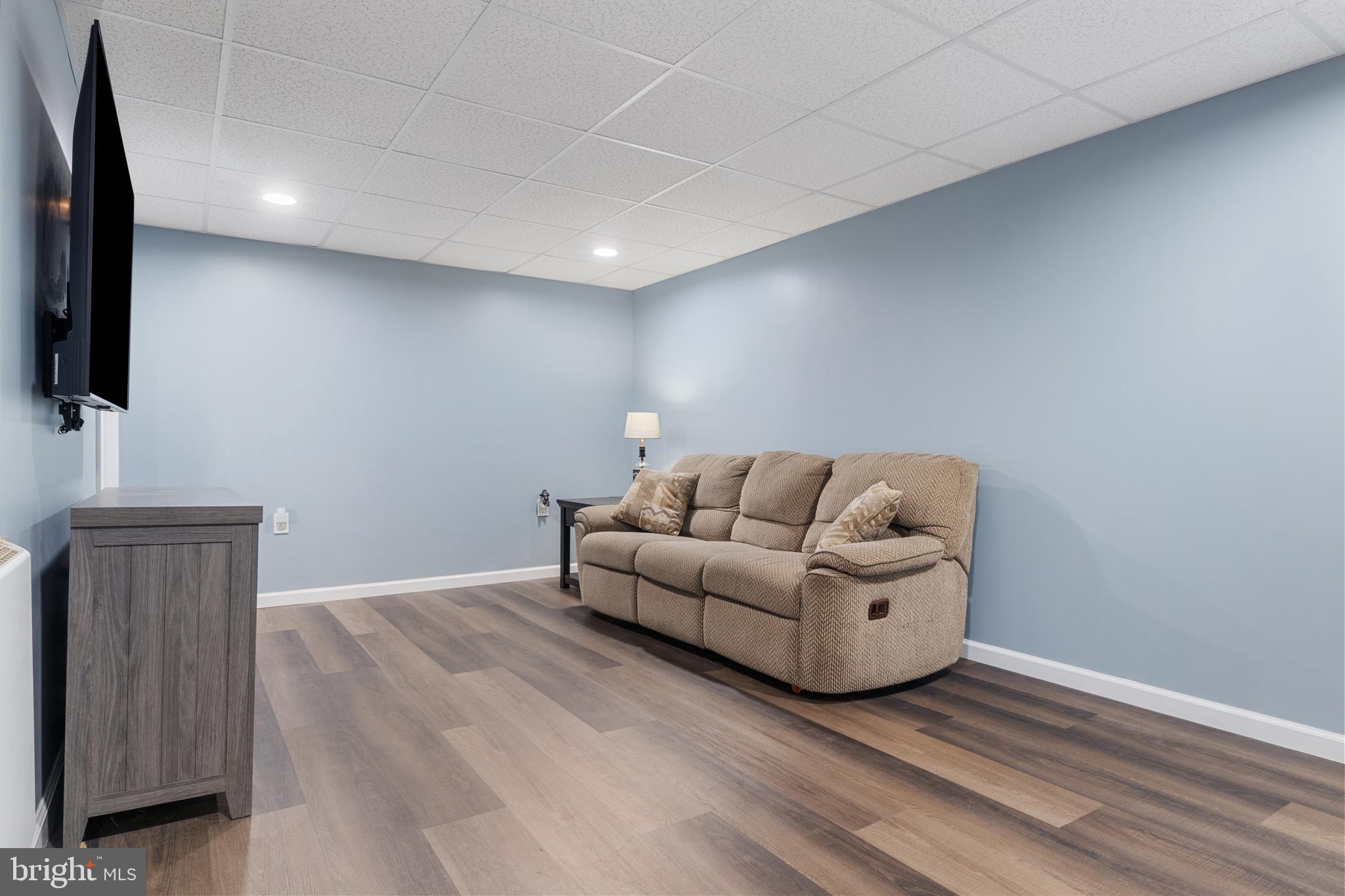 3530 Middleboro Road Dover, PA 17315 - Photo 31 of 57 a living room with couches and a flat screen tv