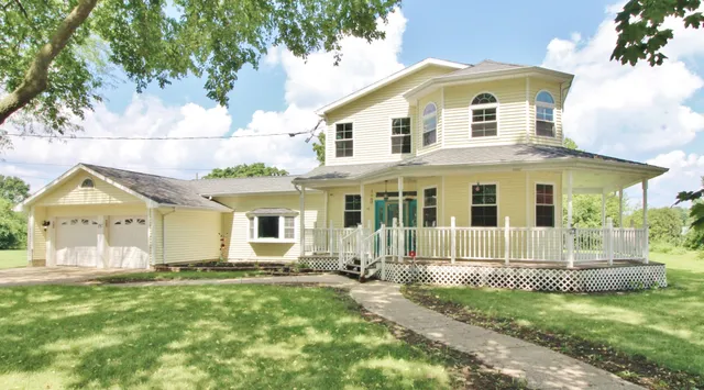 a view of a house with wooden fence