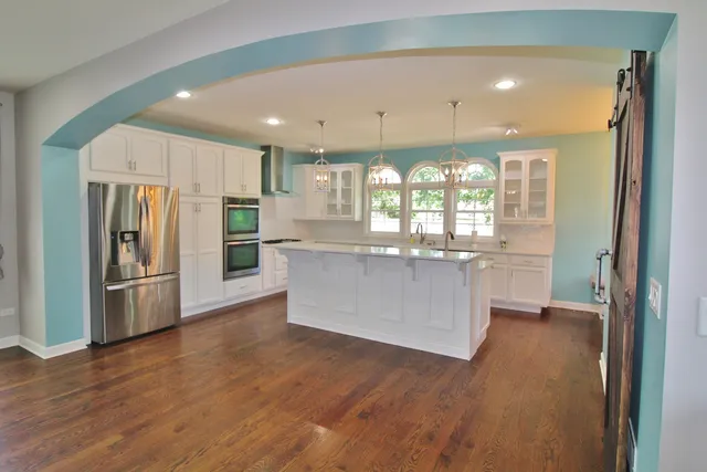 a kitchen with stainless steel appliances a sink and counter top