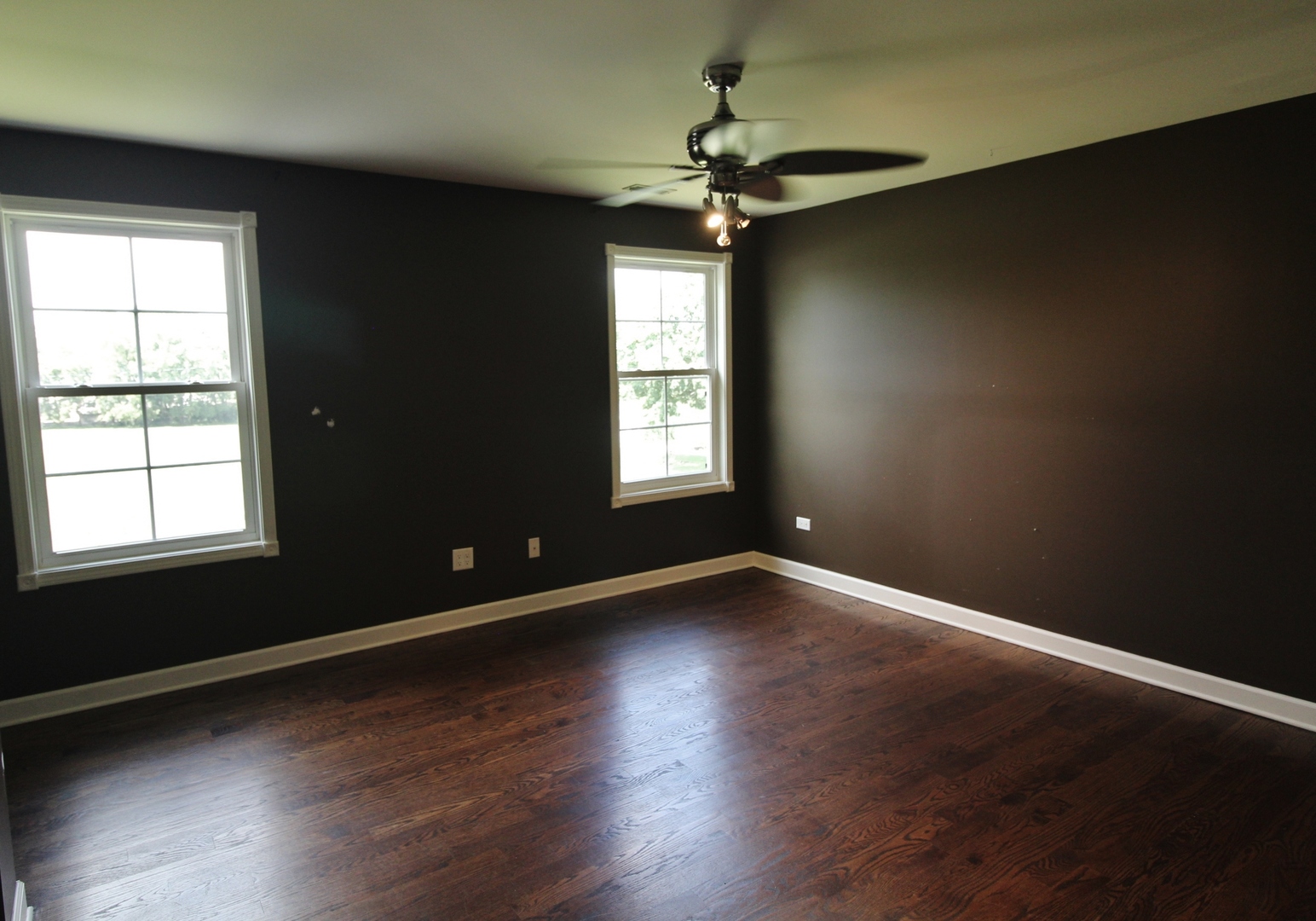 187 West Union Street Seneca, IL 61360 - Photo 29 of 51 a view of an empty room with wooden floor and a window