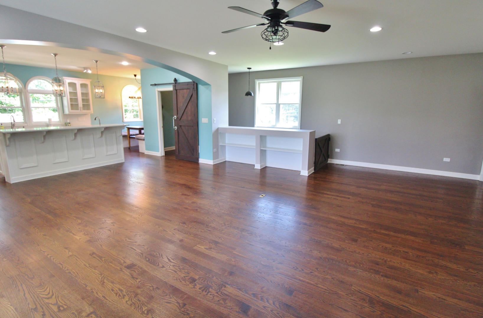 187 West Union Street Seneca, IL 61360 - Photo 9 of 51 an empty room with wooden floor and windows