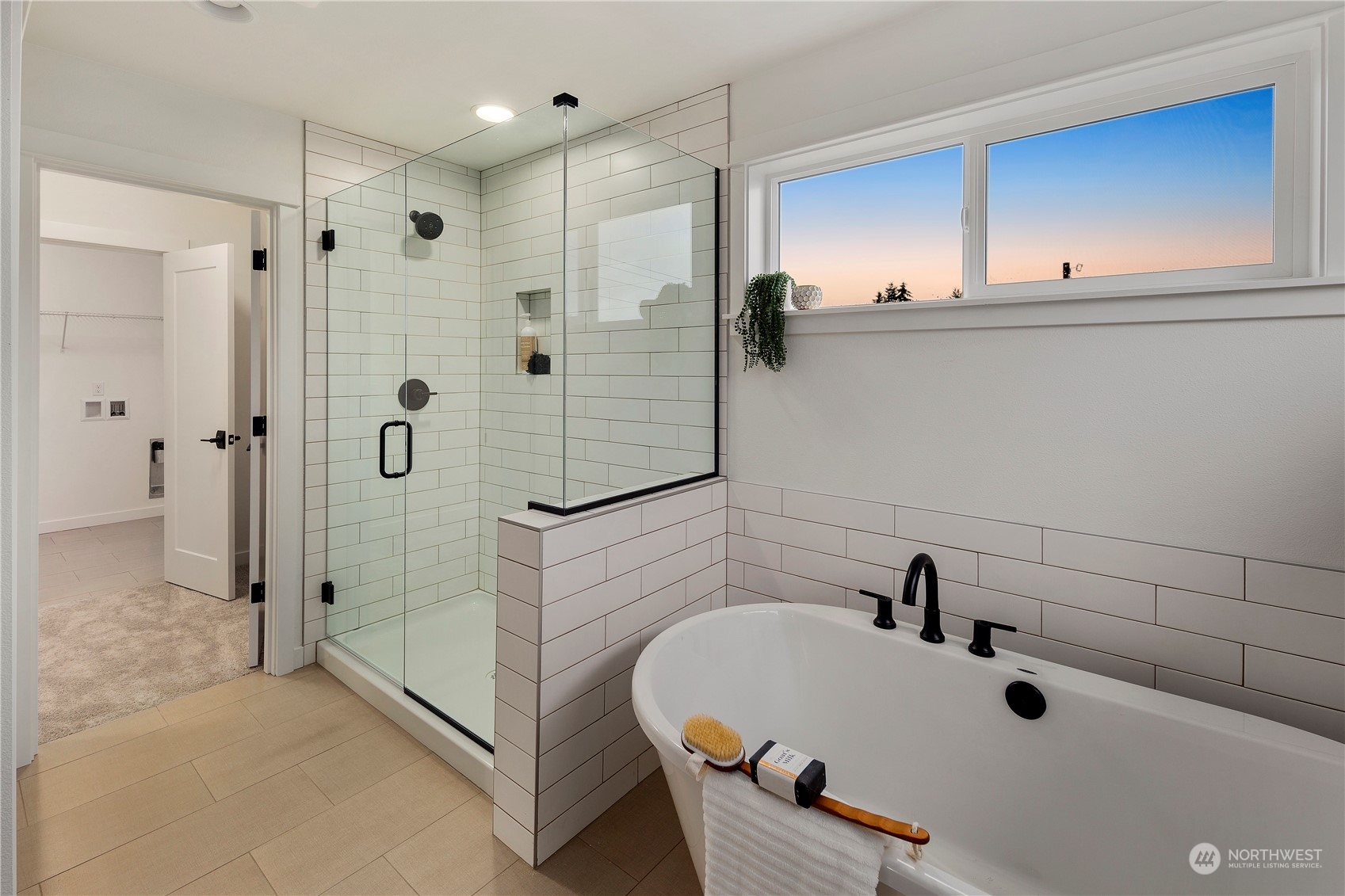 3906 211th Place Southeast Bothell, WA 98021 - Photo 21 of 31 a bathroom with a tub a sink and mirror