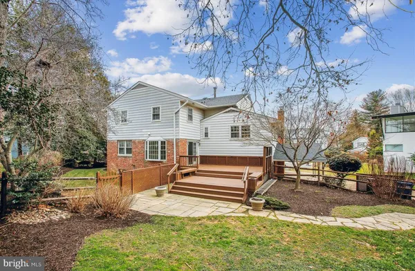 a view of a house with swimming pool and sitting area